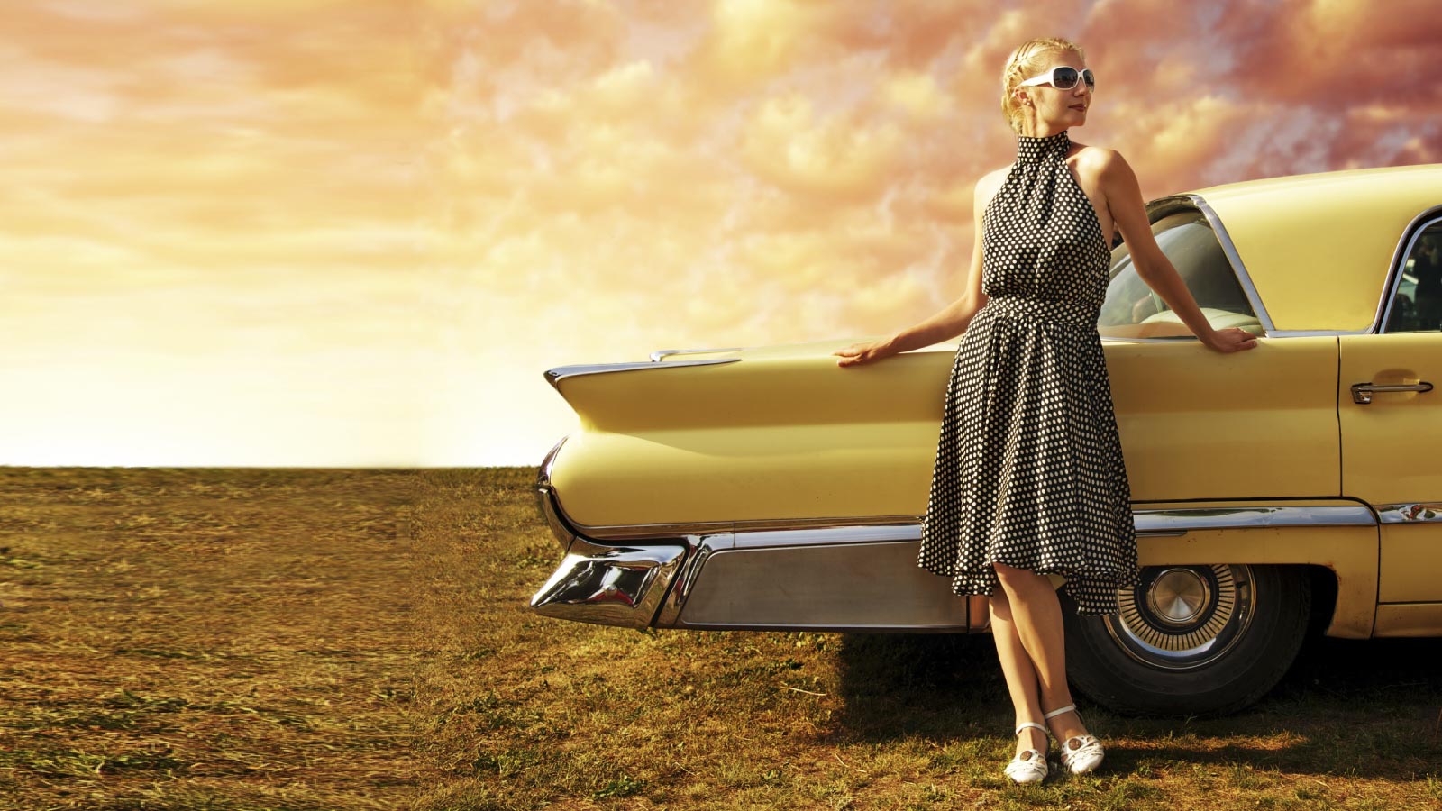 A fashion dressed girl from the 1950s and vintage car.