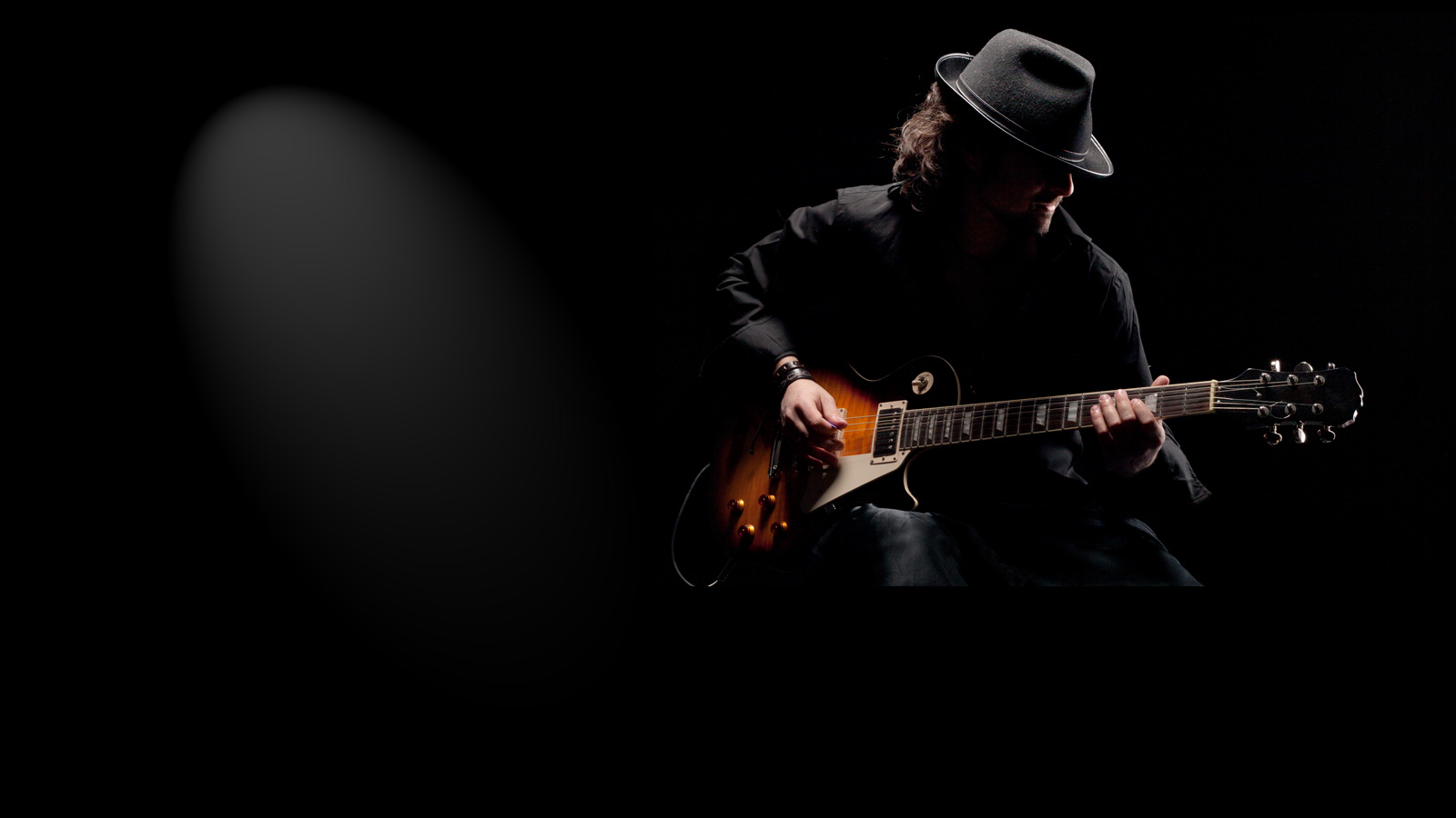 Blues man playing gibson guitar