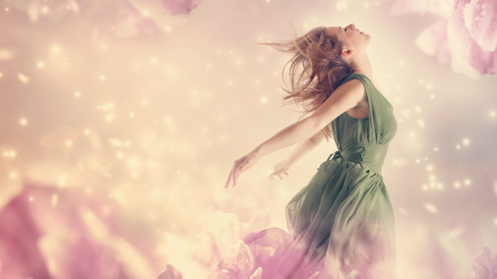 A girl easy flying over light flowers